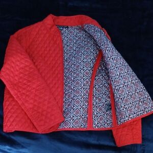 Vibrant Red Quilted Puffer Jacket with Geometric Lining